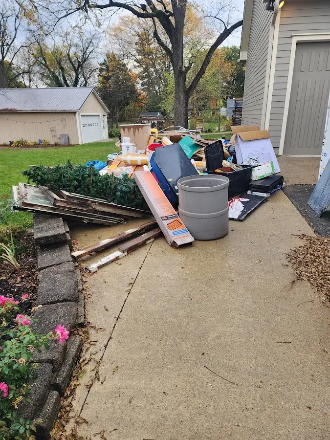 Dumpster being loaded with debris for Residential Dumpster Rental in Sparta